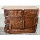 An oak sideboard with four drawers over cupboard enclosed by a pair of panel doors. 46' wide