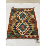 A Chobi Kilim small rug. 0.57m x 0.45m