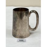 An Edward VIII silver mug of tapered form. Engraved. Sheffield 1936. 4¾' high. 9ozs