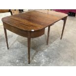 A George III style mahogany dining table extending to 68' long with two leaves. Distressed