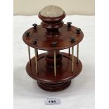 A mahogany cotton reel and pin stand. 8' high