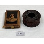 A 19th century lignum vitae carved inkwell, 3¼' diam and an olive wood and leather photograph