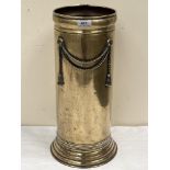 A 1930s brass umbrella stand with applied rope-tie motif. 19' high