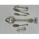 Two silver sugar bows; three silver butter knives and a continental 800 silver table spoon. 4ozs