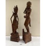 Two Balinese carved wood female figures. The taller 24½' high