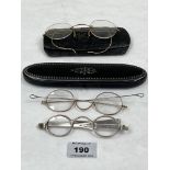 A pair of antique silver spectacles and two pairs of gilt framed examples, one in a Georgian