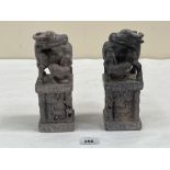 A pair of oriental carved hardstone buffalo and calf groups on pedestals carved with bamboo and