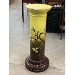 A Victorian Burmantofts Faience jardiniere pedestal, painted with iris flowers on a yellow and brown