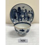 A Chinese blue and white decorated tea bowl and saucer