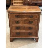 A walnut chest of four long drawers, with brushing slide on cabriole legs. 28' wide