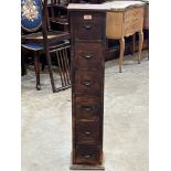 A narrow chest of six oak drawers. 40½' high.