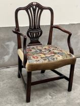 A George III mahogany Hepplewhite style armchair with woolwork tapestry seat on square chamfered