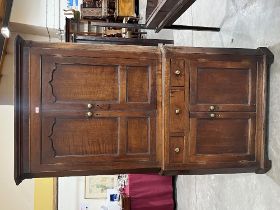 A George III oak standing corner cupboard on bracket feet. 79' high