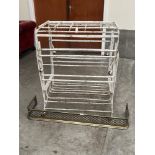 A metal campaign style bedstead and a brass fender