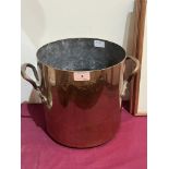 A copper two handled pan. 10' high
