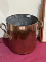 A copper two handled pan. 10' high