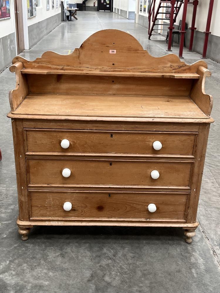 A Victorian pine chest of drawers with galleried top. 42' wide