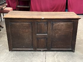 An 18th century joined oak panelled chest. 57½' wide