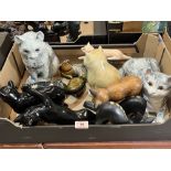 A box of ceramic and wood cats