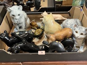 A box of ceramic and wood cats