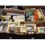 A box of diecast and other toys.