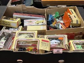 A box of diecast and other toys.