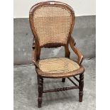 A Victorian side chair with caned balloon back and seat. Back repaired