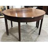 A George III mahogany dining table on square legs. 49' diam.