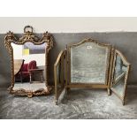 A gilt wall mirror and a triptych dressing mirror