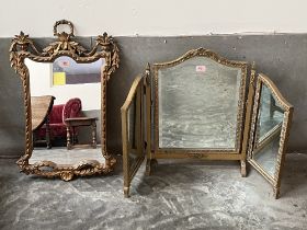 A gilt wall mirror and a triptych dressing mirror