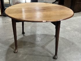 A 19th century drop leaf mahogany dining table on turned legs with pad feet. 47' wide