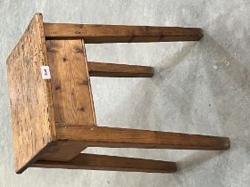 A pine stool on square splayed legs. 22½' high
