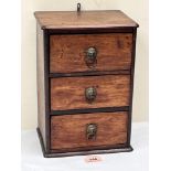 A 19th century miniature mahogany chest of three drawers. 12' high