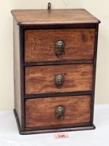 A 19th century miniature mahogany chest of three drawers. 12' high