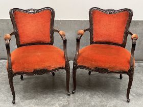 A pair of 1920s mahogany armchairs in the French taste