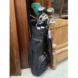 A set of golf clubs with bag