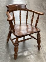 A Victorian smoker's bow armchair