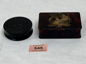 A 19th century ebony snuffbox and a 19th century papier-mache stamp box, 3¾' wide.