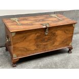 An Anglo-Rhodesian walnut chest with brass strap hinges, side handles and lock hasp, on ball and