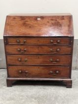 A George III mahogany bureau with fitted interior on bracket feet. 39' wide