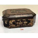 A Japanese Meiji period octagonal lacquer workbox all over decorated with chinoiseries with fitted