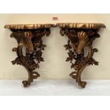 A pair of gilt resinous wall brackets. 18½' high. One cracked