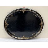 A Victorian papier-mache oval tray in the manner of Jennens and Bettridge. 29½' wide. Losses to rim