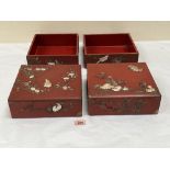 Four Japanese red lacquer boxes, two with covers, decorated with mother-of-pearl and carved