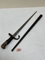 A French sword bayonet with scabbard. Length of blade 20½'. 19th century.