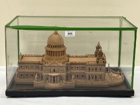 A cased scratch-built wood model of St. Pauls Cathedral. The case 20" wide.