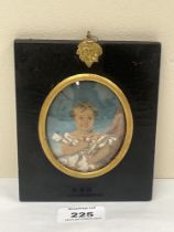 A 19th century portrait miniature of a young child - The ebonised frame 5¼" high.