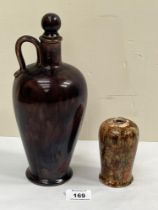 A Royal Doulton whisky flask and stopper, no 15438, 10¼" high; together with a small mottle glazed