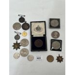 A collection of coins and badges.