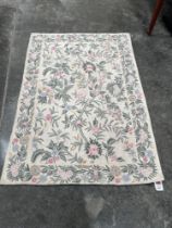 A Kashmiri wool stitched chain rug. 1.58m x 1.1m.